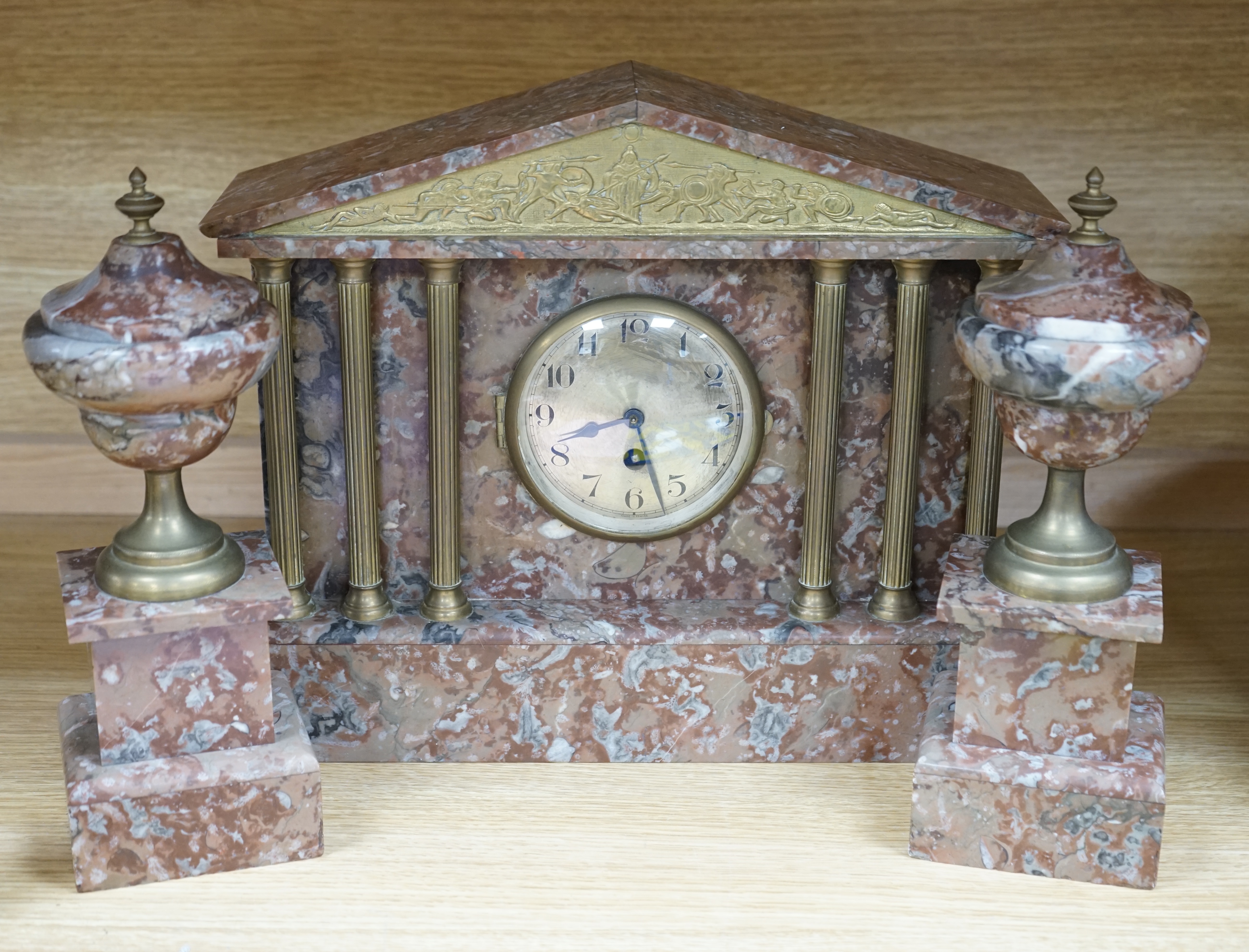 A Victorian rouge marble clock garniture, 30.5cm high. Condition - fair to good